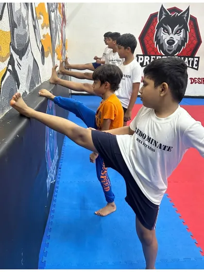 Inspire your child to be active. Students practice their kicks, building flexibility and strength.