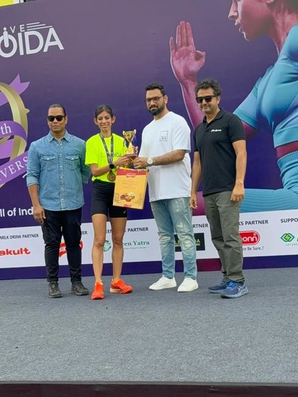 Receiving the overall winner trophy at a 10K race in Noida. Even on days when the mind and body aren't in sync, discipline gets you to the finish line. This win is a reminder that running is as much a mental game as a physical one.