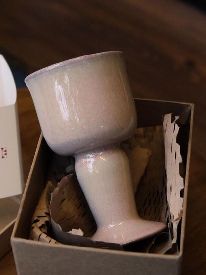 The 'Kāge' goblet, unboxed. Its unique shape and delicate pink glaze are the result of months of prototyping and refinement.