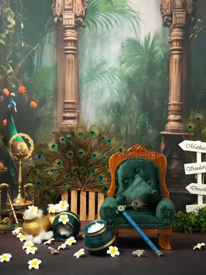 A preview of our elaborate Janmashtami mini session setup, featuring a royal chair, peacock feathers, and a mythical forest backdrop.