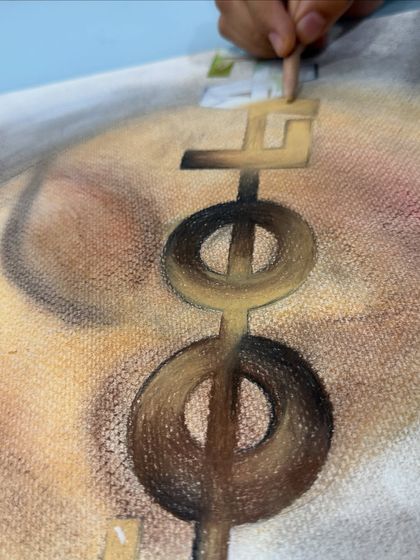 A close-up view of a student's work with colored pencils on canvas. This piece showcases the development of advanced techniques, such as creating depth and form through meticulous layering and blending of colors.