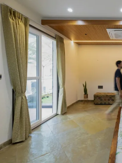 The flooring in the master bedroom is cool Kota stone laid in a diamond pattern, which contrasts beautifully with the warm wood ceiling detail.