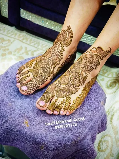 Another angle of a detailed foot mehandi, showing how the design covers the top of the foot with elegant swirls and patterns.