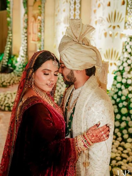 A romantic portrait of the bride and groom, where her elegant updo is visible.