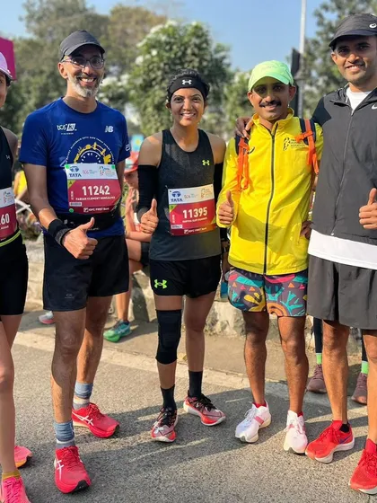 Thumbs up from the team. Another great group photo from the Mumbai Marathon, capturing the spirit of our running family.