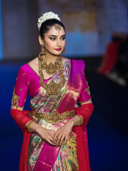 Capturing the energy of the runway for the show stopper at Bangalore Times Fashion Week. This shot highlights the rich colors and textures of the traditional South Indian attire under professional show lighting.