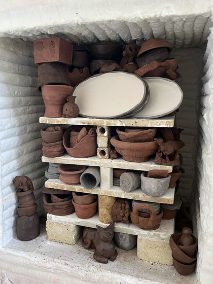 This is our gas kiln, packed with nearly 200 pieces of student work ready for a biscuit firing. As a member, you get access to our shared kiln firing services, so you don't have to manage the technical side yourself.