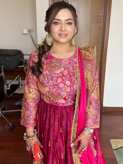 A Mehendi look to save. This style features gorgeous kohl-rimmed eyes and a messy braid, creating a look that is both traditional and effortlessly cool.