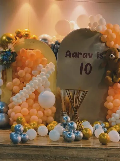 Another view of the elegant 10th birthday setup, showing the layered backdrops and balloon arrangement.
