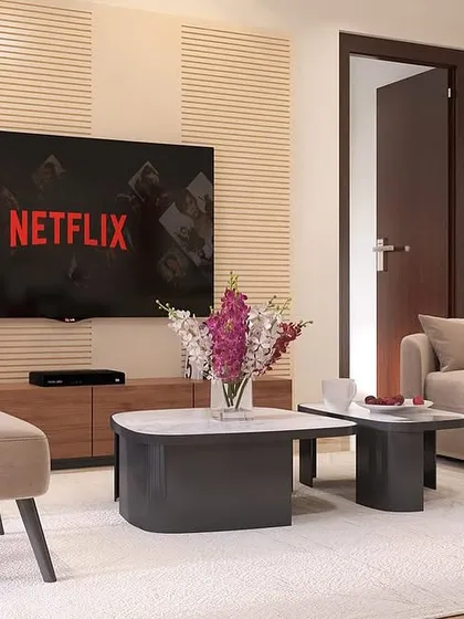 This minimalist living room design proves that simplicity can be stunning. The clean lines of the furniture, the fluted wall paneling behind the TV, and the neutral color scheme create a sophisticated and uncluttered space.