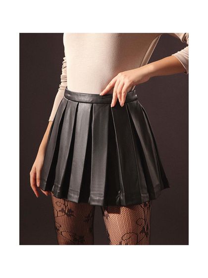 A close-up product shot for a brand's catalogue. I styled this faux leather pleated skirt with patterned lace stockings to give it a street-chic, slightly edgy vibe.