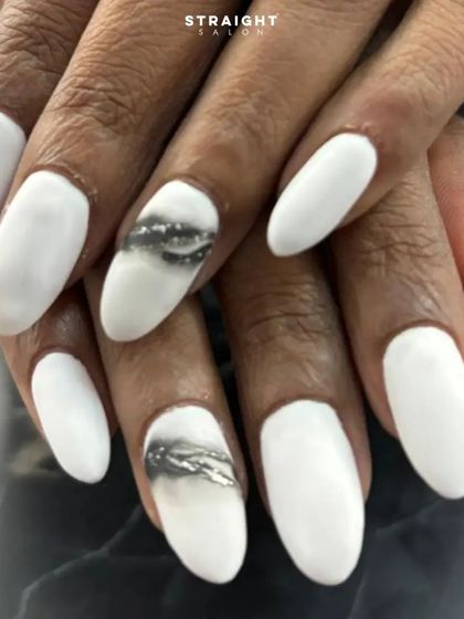 A close-up of the smoky glitter accent nail. The effect is created by blending black polish with silver glitter for a unique, textured look.