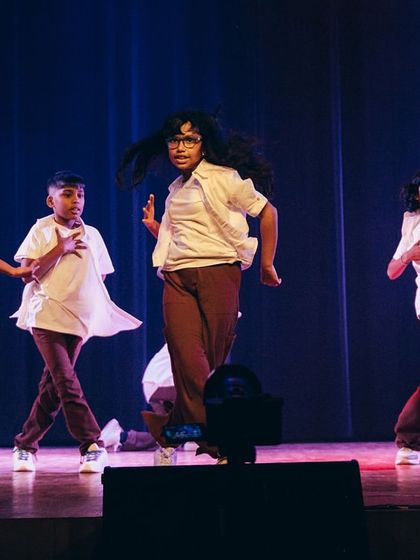 The dancers embody the story with focused expressions and strong movements. This piece teaches both performance skills and the importance of empathy.