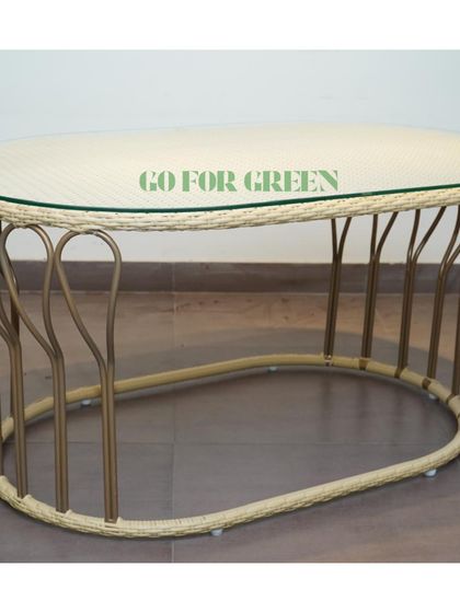 The elegant oval coffee table from our rattan-style lounge set. The glass top and intricately designed base make it a beautiful centerpiece for any outdoor seating arrangement.