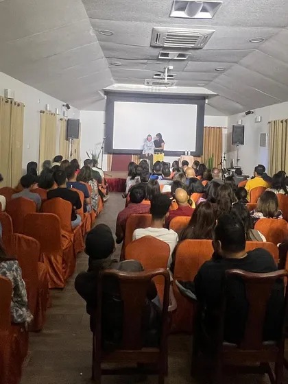 A view from the back of the room at an Everest Toastmasters event. It shows a full house, which is always great to see.
