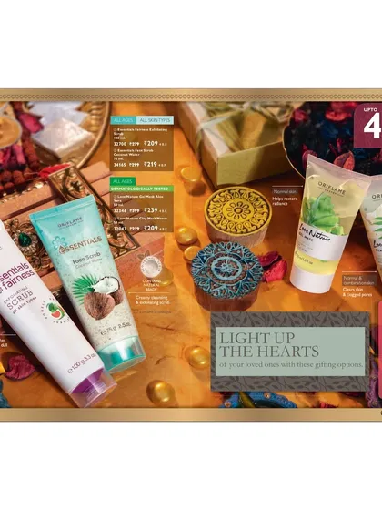 A festive gifting layout for various Oriflame skincare scrubs and lotions. The warm lighting and traditional props are used to evoke a celebratory mood, encouraging seasonal purchases.