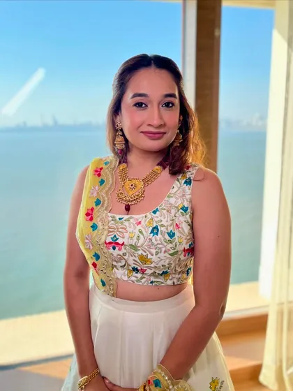 Sheer glow and radiance. This look for a bridesmaid features a fresh, dewy base and soft makeup to complement her colorful outfit.