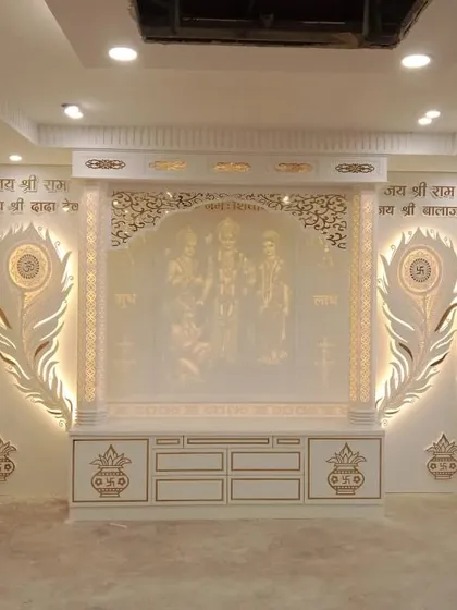 A grand mandir design in Corian finish, featuring Lord Ram's family and peacock feather motifs. The entire unit is backlit for a divine glow.