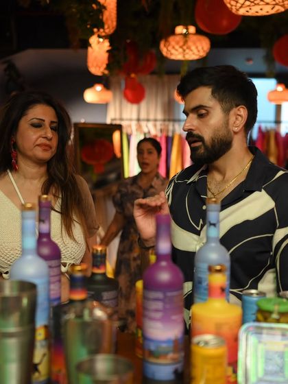 Guests enjoying artisanal beverages at the bar during our Aulerth X Kavana event. We believe in creating a complete sensory experience for our community.