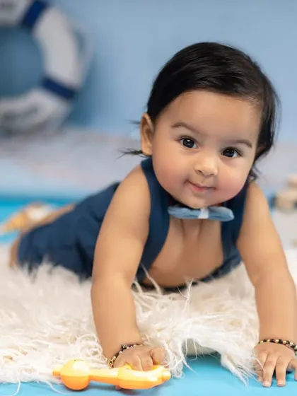 Ready to explore the deep blue sea. This close-up from our nautical-themed shoot captures this little sailor's sweet expression as he gets ready for his adventure.