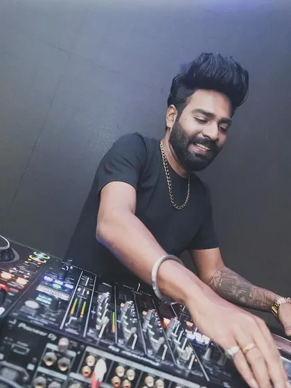 A close-up shot of me smiling while working the controls at SinQ.
