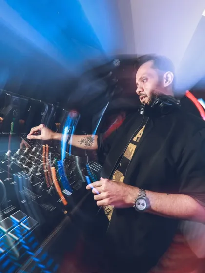 In the zone, mixing tracks and reading the room. This shot captures me doing what I love, blending beats to keep the party going, whether it's a high-energy tech house set or a retro pop night.