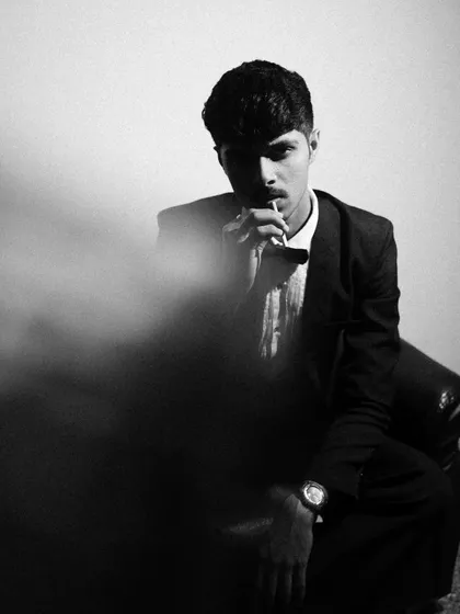 More from the black and white tuxedo series, exploring different poses and lighting angles. I used smoke and shadows to add texture and mood.