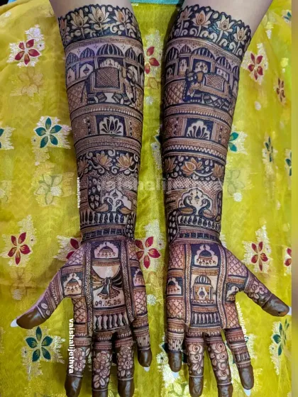 This bridal design is packed with wedding rituals. It features the doli ceremony, the gathbandhan (tying the knot), elephants, and peacocks, capturing the essence of an Indian wedding.
