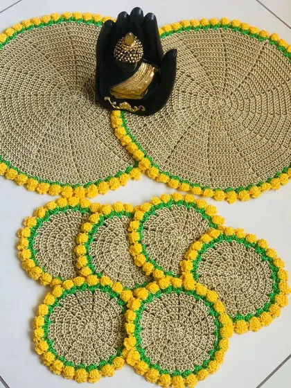 Here is a complete set of fawn-colored placemats and matching coasters, all finished with a bright yellow tulip border. This set makes a wonderful housewarming gift.