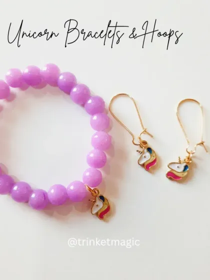 For the purple lovers, this set features a lavender beaded bracelet with a unicorn charm and matching hoop earrings. It's a fun and colorful choice for kids.