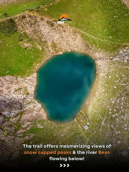 An aerial view of the stunningly clear, turquoise water of the Beas Kund glacial lake.