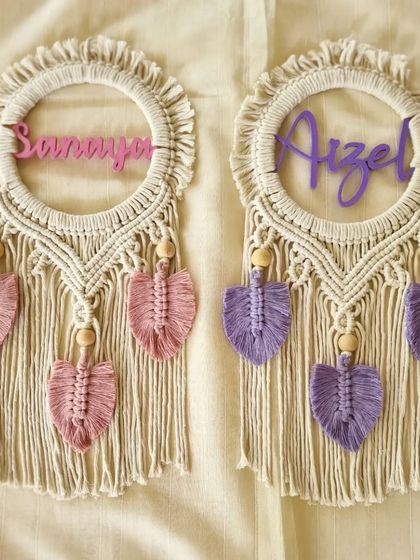 Perfect for siblings sharing a room, these macrame name hangings for 'Sanaya' and 'Aizel' were customized in pink and purple. They are a wonderful addition to any kid's room decor.