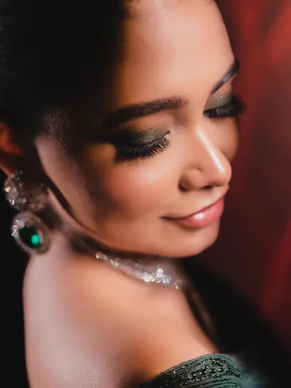 A soft, downward glance showing off the beautiful blend of the eyeshadow and the full, fluttery lashes.