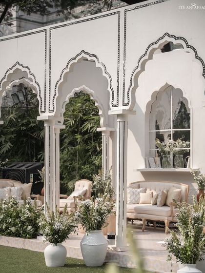 A closer look at the seating alcoves within the 'Oasis of Love' pavilion, adorned with delicate mirror inlay work on the arches.