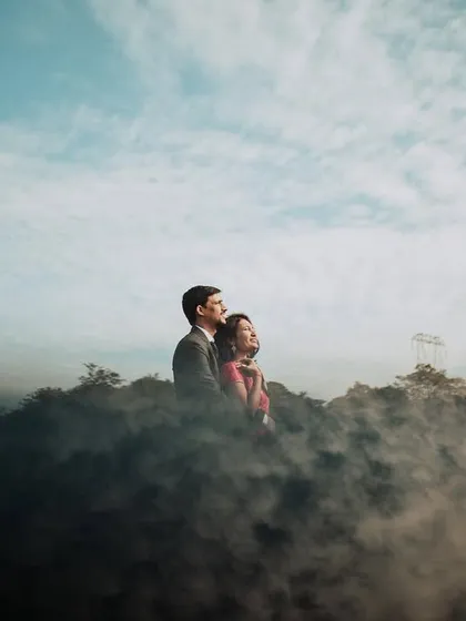 A truly magical pre-wedding moment for this couple, wrapped in mist on a Lonavla hilltop. We used a smoke effect to create this dreamy, 'head in the clouds' feeling, making their love story look like a scene from a movie.