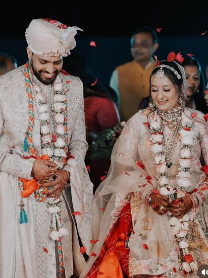 A candid moment from a wedding, showing the bride in one of my rental necklace sets. The jewellery complements her pastel lehenga perfectly.