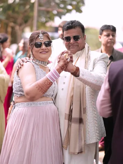 Parents of the groom enjoying the baraat. We love capturing these moments of family members dancing and celebrating together.