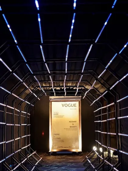 A futuristic entrance tunnel made of blue LED light strips, creating a high-impact and memorable arrival experience for guests.