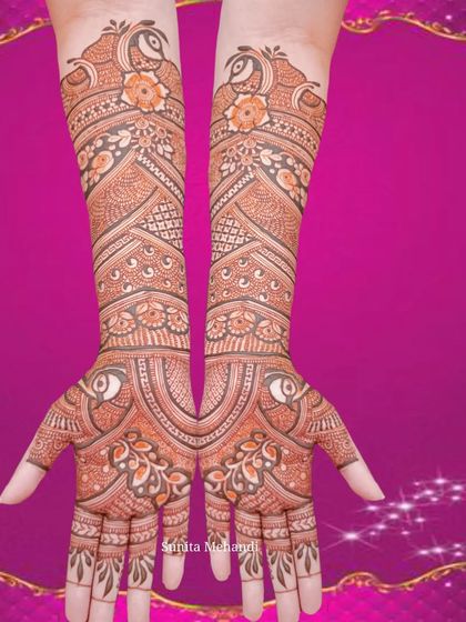 This is a beautiful example of a mirror-image design, where both hands are decorated with identical patterns. The design is centered around peacock motifs on the arms and hands.