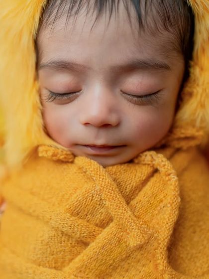 Another beautiful close-up, focusing on the baby's peaceful expression and perfect features.