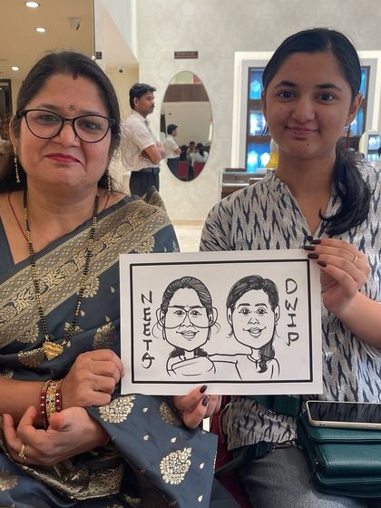 Another example of a mother-daughter caricature, showcasing the classic black and white style that is quick, fun, and always a crowd-pleaser.