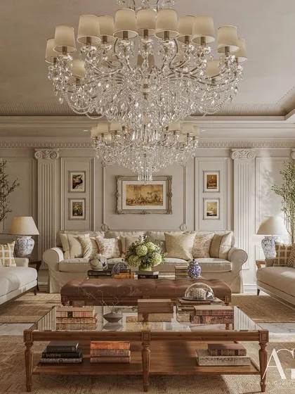 A full view of the drawing room, where two grand crystal chandeliers command the space. The symmetrical arrangement of furniture, flanked by potted trees, creates a sense of balanced and cultivated opulence.