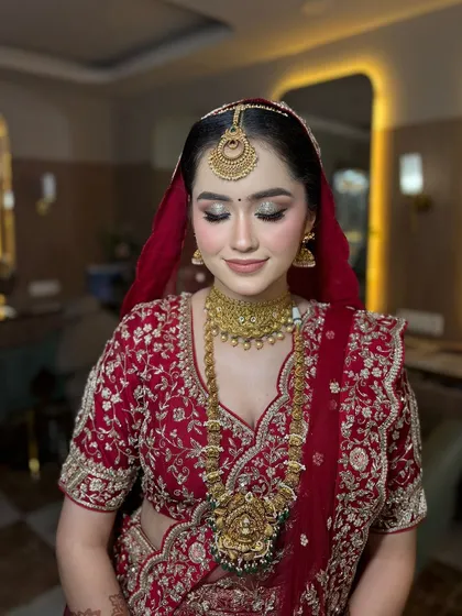 A beautiful, happy bride ready for her wedding. We went with a soft, shimmery eye and a flawless base to complement her traditional red lehenga and gold jewellery, a perfect look for a morning ceremony.