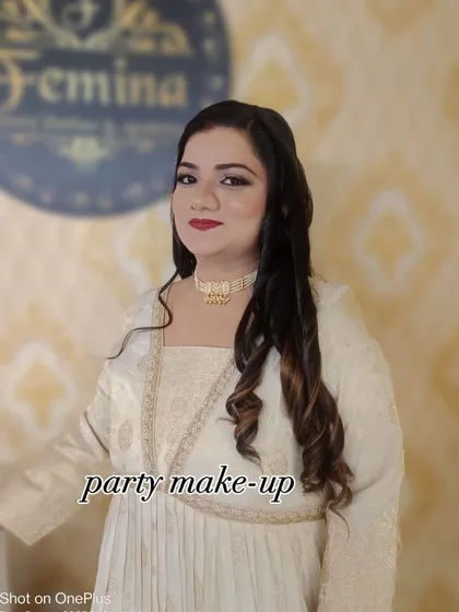 A soft and elegant party makeup look. The client is wearing a beautiful cream-colored outfit, and I created a look with subtle smokey eyes, a nude-pink lip, and soft curls.
