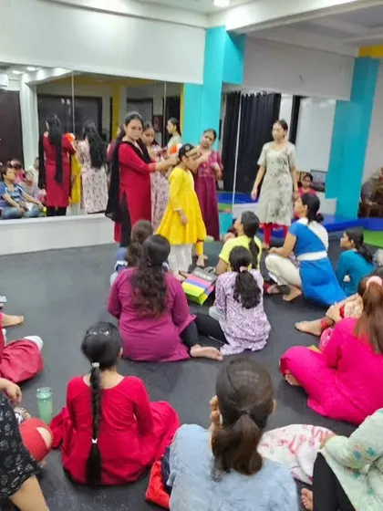 A wide shot of the makeup workshop, showing the engaged and curious faces of our students. We believe in a 360-degree approach to dance education.