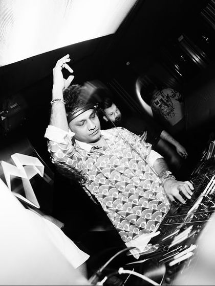 A black and white, motion-blurred shot of me at the decks in Dubai, capturing the movement and energy.