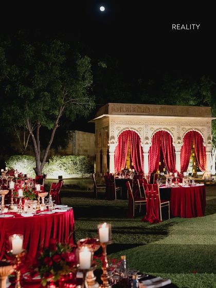 Reality: The sangeet night, exactly as we imagined it. The rich red velvet, the warm candlelight, and the open-air setting came together to create an atmosphere of romance and festivity, proving the power of a well-executed plan.