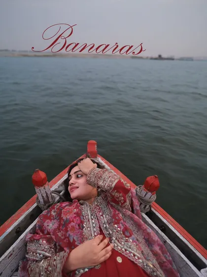 Finding peace in the heart of Banaras. A serene portrait of a woman lost in thought while floating on the Ganga, embodying the city's tranquil spirit.