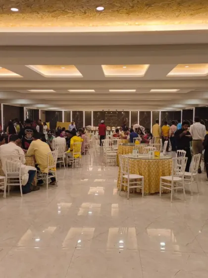 A live event in progress at Palm Beach Banquet, Vashi. This shot shows the round table dining setup, allowing guests to socialize comfortably during the event.