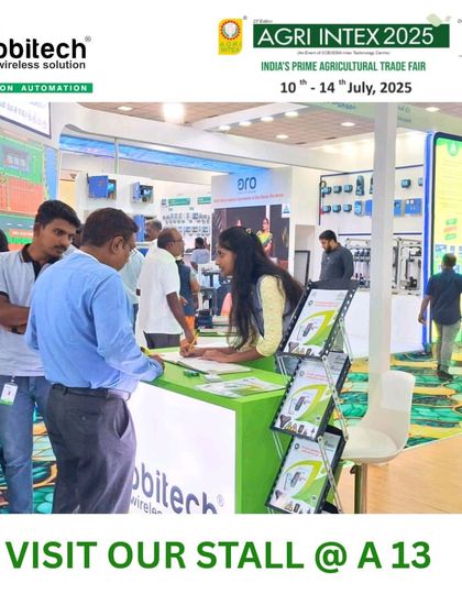 Visitors registering and interacting with our team at the front desk of our stall.